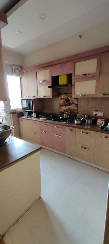 Kitchen in 4 BHK Apartment at Puri Pranayam, Sector 82 – for Sale