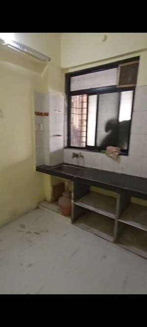 Kitchen in 2 BHK Apartment at Omkar Puram CHS, Adai – for Sale