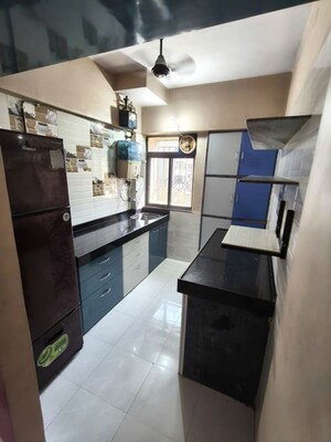 Kitchen in 1 BHK Apartment at Krishna Greenland Park Vastu Federation, Ghodbunder Road – for Rent