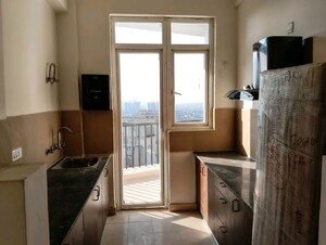 Kitchen in 3 BHK Apartment at Amrapali Heartbeat City, Sector 107 – for Rent