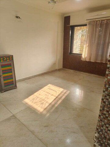 Living Room in 1 BHK Apartment at Manik Prabhu Kripa CHS, Andheri West – for Rent