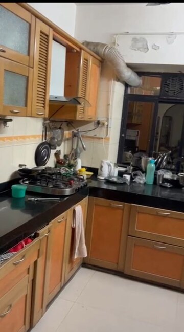 Kitchen in 3 BHK Apartment at Riddhi Garden, Malad East – for Rent