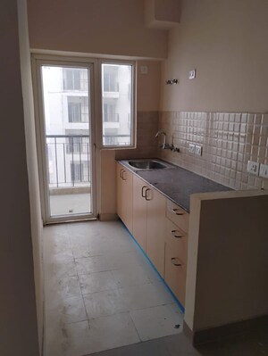 Kitchen in 1 BHK Apartment at Amrapali Dream Valley, Tech Zone 4 Greater Noida – for Rent