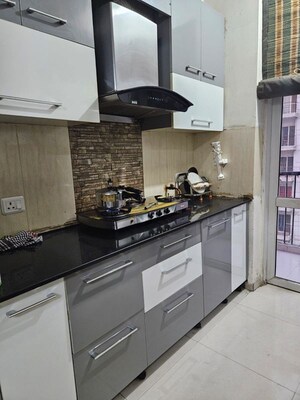 Kitchen in 2 BHK Apartment at Prateek Wisteria, Sector 77 – for Rent