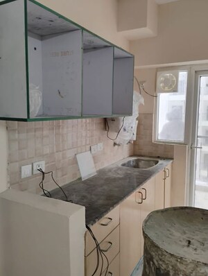 Kitchen in 1 BHK Apartment at Amrapali Dream Valley, Tech Zone 4 Greater Noida – for Sale
