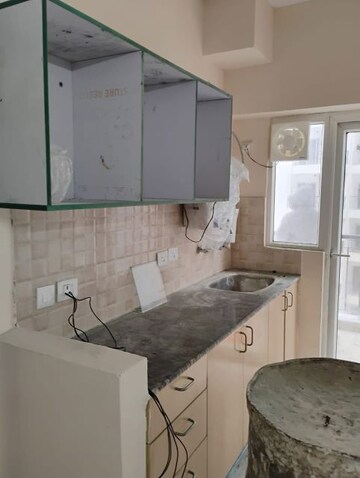 Kitchen in 1 BHK Apartment at Amrapali Dream Valley, Tech Zone 4 Greater Noida – for Sale