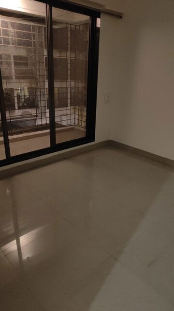 Room in 2 BHK Apartment at Sai Siddhant D N Nagar Krishna CHS LTD, Andheri West – for Rent
