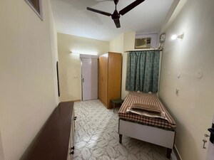 Bedroom in 2 BHK Builder Floor at Nehru Enclave – for Rent
