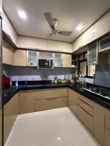 Kitchen in 2 BHK Apartment at Om Sai Plaza, Ghodbunder Road – for Sale