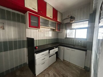 Kitchen in 1 BHK Apartment at Tulips B CHS Ltd, Ghodbunder Road – for Sale