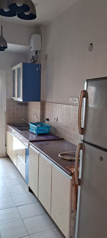 Kitchen in 3 BHK Apartment at Mahagun Moderne, Sector 78 – for Rent