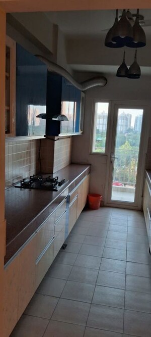 Kitchen in 3 BHK Apartment at Mahagun Moderne, Sector 78 – for Rent