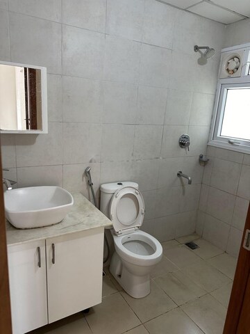 Bathroom in 2 BHK Apartment at Bhartiya City Nikoo Homes 4, Thanisandra Main Road – for Rent