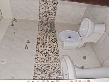 Bathroom in 2 BHK Apartment at Charms Castle, Raj Nagar Extension – for Rent