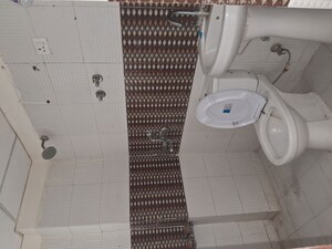 Bathroom in 2 BHK Apartment at Charms Castle, Raj Nagar Extension – for Rent