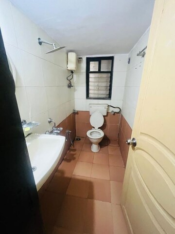 Bathroom in 2 BHK Apartment at Satellite Garden, Goregaon East – for Rent