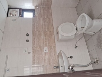 Bathroom in 2 BHK Apartment at Charms Castle, Raj Nagar Extension – for Sale