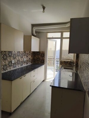 Kitchen in 2 BHK Apartment at Amrapali Enchante, Tech Zone 4 Greater Noida – for Sale