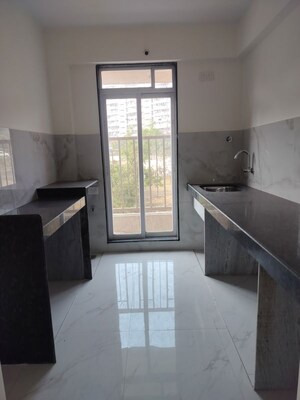 Kitchen in 1 BHK Apartment at Metropolis Bayside, Kasarvadavali – for Sale
