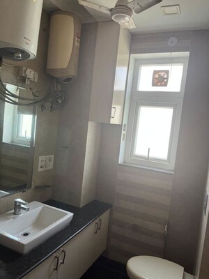 Bathroom in 3 BHK Apartment at Panchsheel Enclave – for Rent