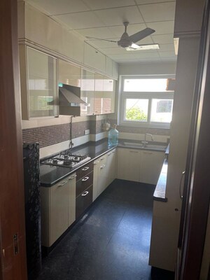 Kitchen in 3 BHK Apartment at Panchsheel Enclave – for Rent