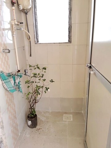 Bathroom in 1 BHK Apartment at Charkop Om Shree Siddhivinayak CHS, Kandivali West – for Rent
