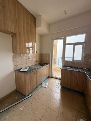 Kitchen in 3 BHK Apartment at Amrapali Crystal Homes, Sector 76 – for Rent
