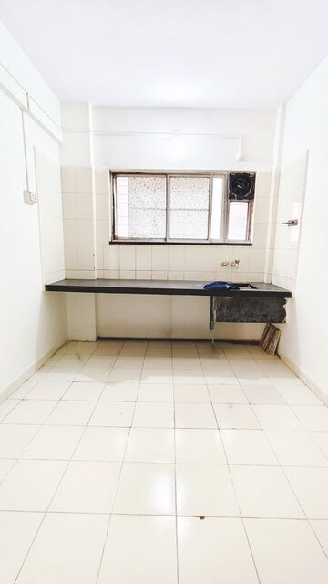 Kitchen in 1 BHK Apartment at Rewa CHS, Viman Nagar – for Rent