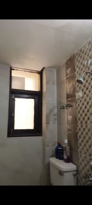 Bathroom in 2 BHK Apartment at Raj Nagar Extension – for Sale