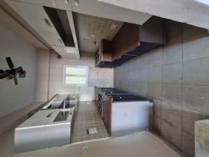 Kitchen in 3 BHK Apartment at Mahagun Moderne, Sector 78 – for Sale