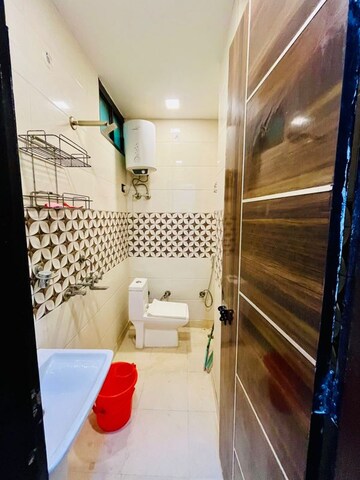 Bathroom in 3 BHK Builder Floor at Dwarka Mor – for Rent