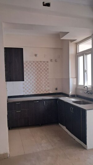 Kitchen in 2.5 BHK Apartment at Amrapali Princely Estate, Sector 76 – for Sale