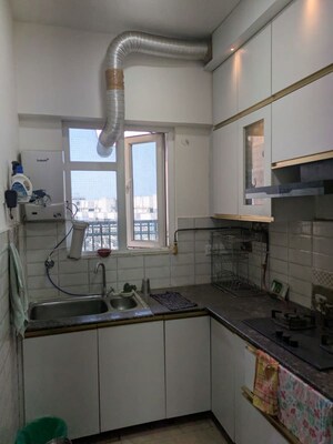 Kitchen in 2 BHK Apartment at Gaur City 2 - 14th Avenue, Sector 16c Greater Noida – for Rent