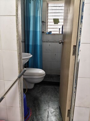 Bathroom in 1 BHK Apartment at Yashovardhan Society, Mahim – for Rent