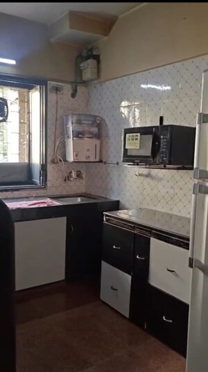 Kitchen in 2 BHK Apartment at Shiv Parvati, Malad West – for Sale