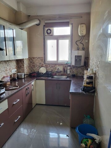 Kitchen in 3 BHK Apartment at Golf Course Road – for Rent