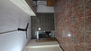 Kitchen in 1 BHK Apartment at Siddhivinayak Tower Runwal Nagar, Kolbad – for Rent