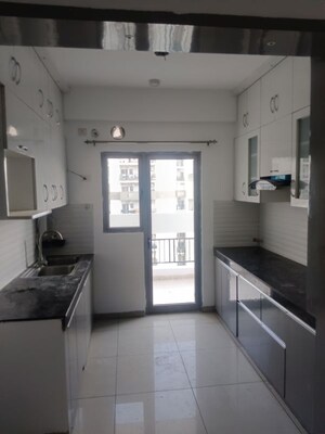 Kitchen in 3 BHK Apartment at Gulshan Bellina, Sector 16 Greater Noida – for Rent