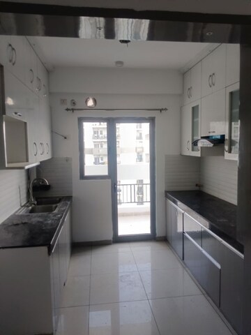 Kitchen in 3 BHK Apartment at Gulshan Bellina, Sector 16 Greater Noida – for Rent