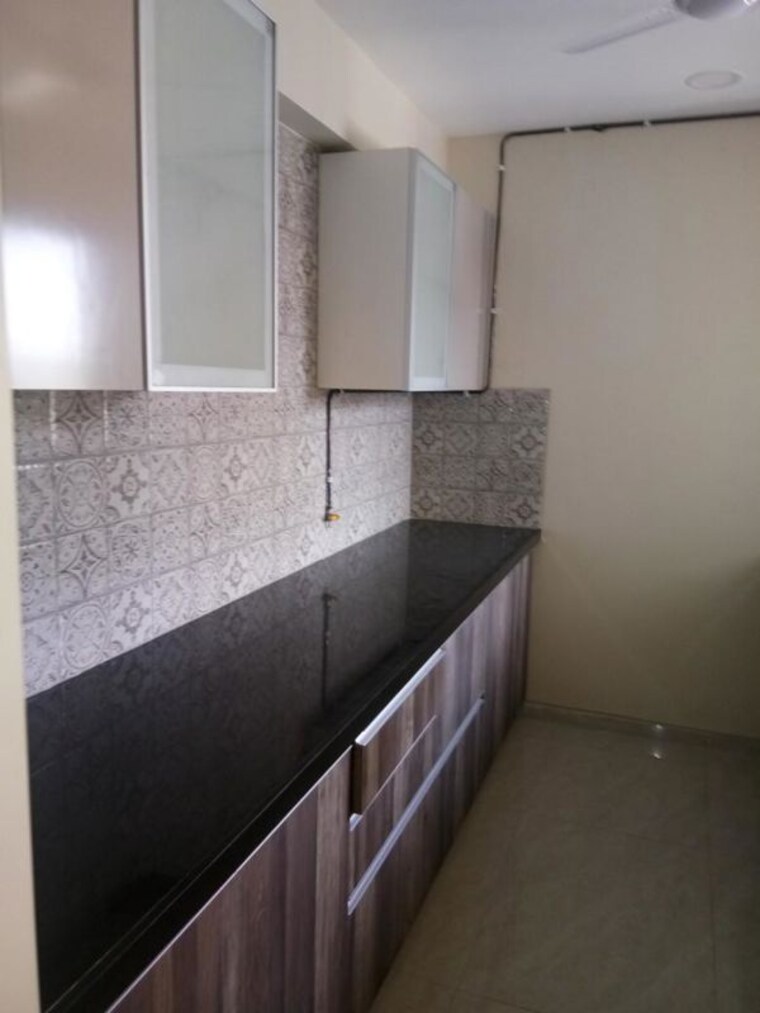 Kitchen, supreme-19 2 Bedroom 840 Sq.Ft. Apartment In Lokhandwala Mumbai 9969258