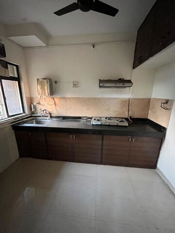 Kitchen in 1 BHK Apartment at Highland Residency CHSL, Balkum Pada – for Sale
