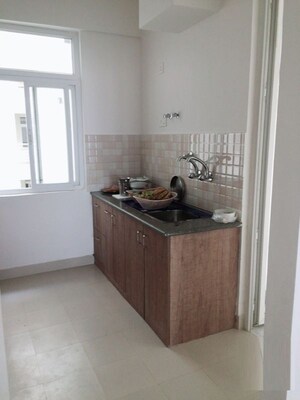 Kitchen in 2 BHK Apartment at Tulsiani Luvnest, Vrindavan Yojna – for Sale