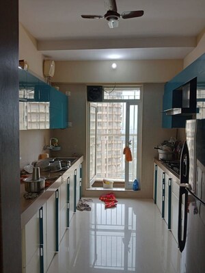 Kitchen in 2 BHK Apartment at Dosti Group Imperia, Manpada – for Rent