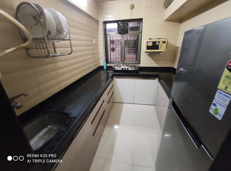 Kitchen, apna-ghar-chs-andheri-west 3 Bedroom 900 Sq.Ft. Apartment In Andheri West Mumbai 9971106