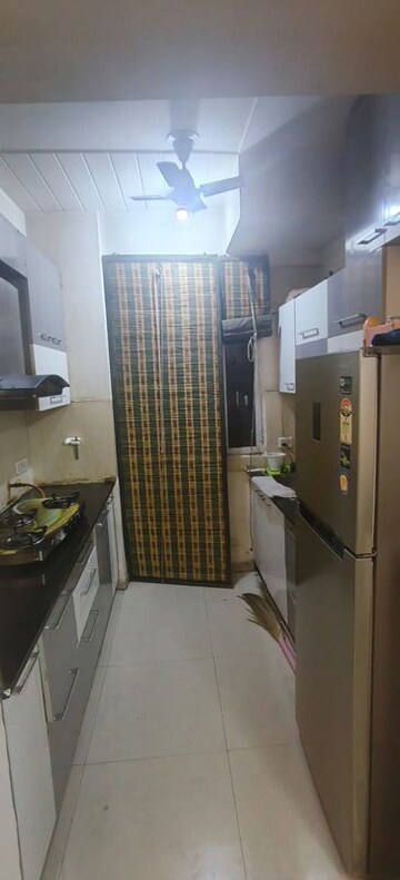Kitchen in 2 BHK Apartment at Prateek Wisteria, Sector 77 – for Rent