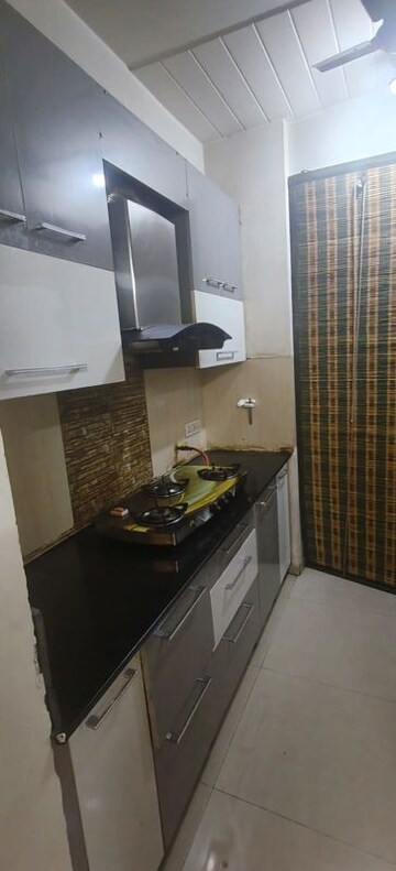 Kitchen in 2 BHK Apartment at Prateek Wisteria, Sector 77 – for Rent