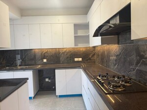 Kitchen in 3.5 BHK Builder Floor at Ansal API Esencia, Sector 67 – for Rent