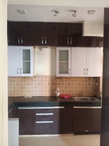 Kitchen in 3 BHK Apartment at Exotica Dreamville, Sector 16c Greater Noida – for Rent