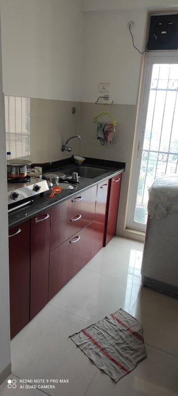 Kitchen in 1 BHK Apartment at Vijay Galaxy, Waghbil – for Rent