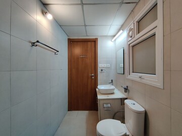 Bathroom in  Apartment at Bhartiya Nikoo Homes Phase 2, Thanisandra Main Road – for Rent